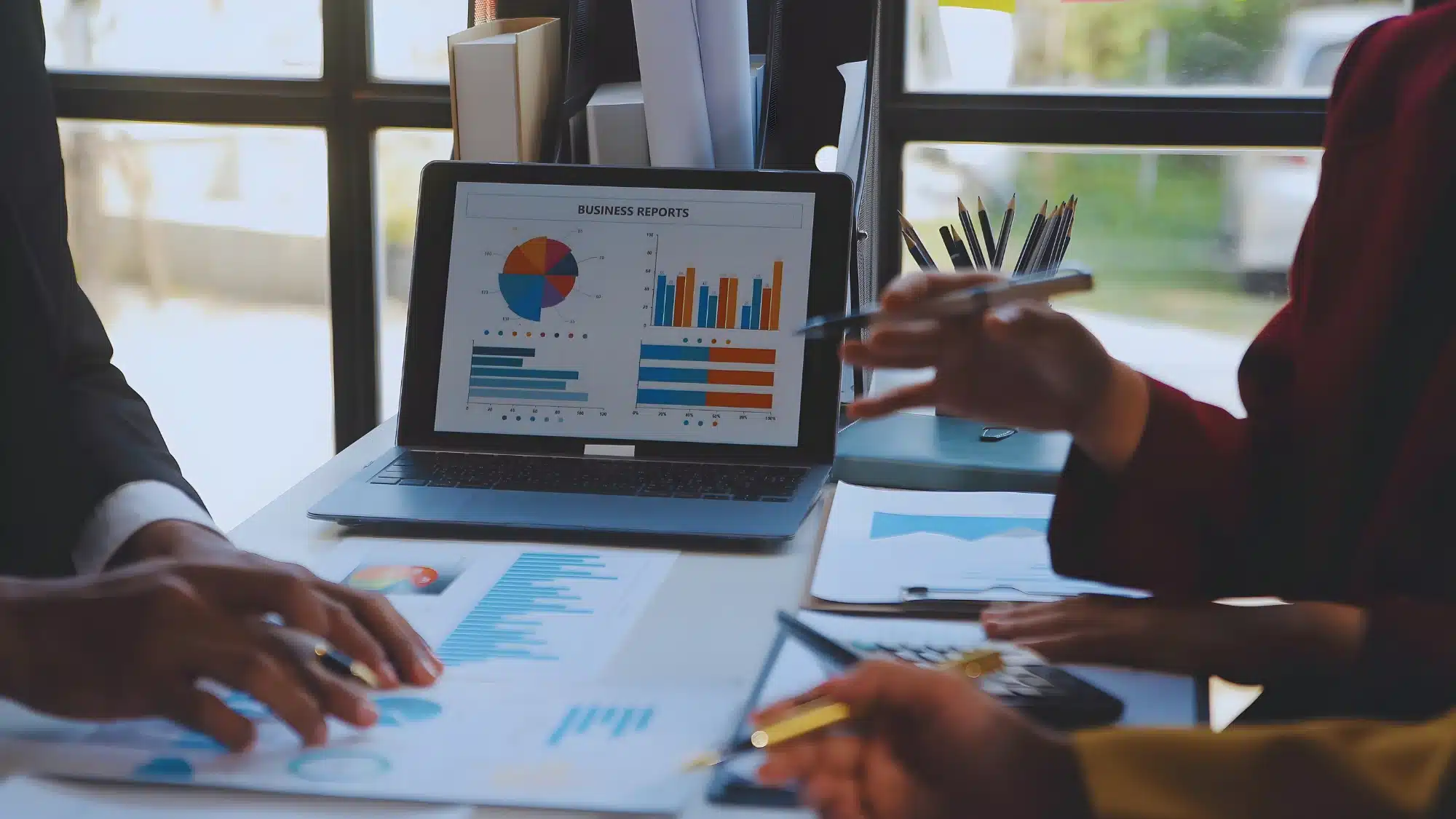 essential-accounting-reports-every-business-should-be-using Business professional reviewing essential accounting reports such as profit and loss, balance sheet, and cash flow statements