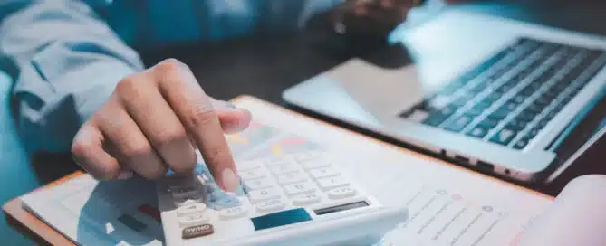 A tidy desk showcasing organized financial documents and a laptop, symbolizing clarity and growth.