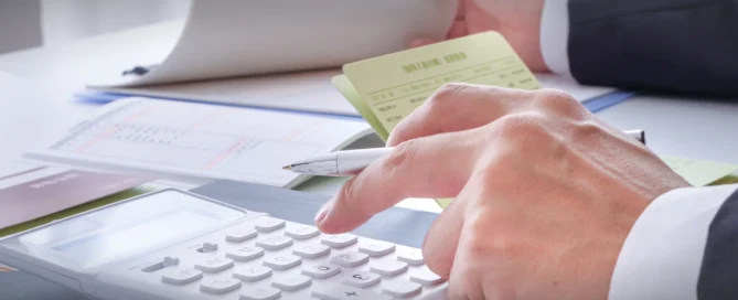 Two financial professionals, a CPA and a bookkeeper, collaborating on business documents.